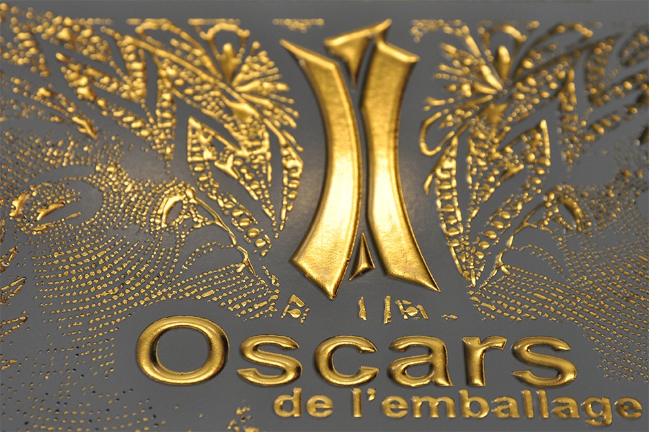 Gold hot-foil embossed packaging design with ornate decorative patterns and the word ‘Oscars’ prominently foiled