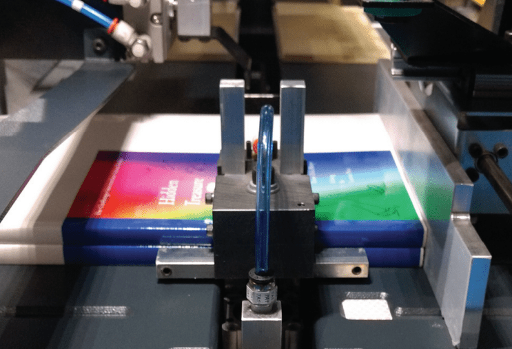 Multiple book stacking input on Challenge Machinery CMT Book Trimmers
