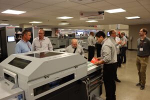 People look at books from the Horizon Mark IV