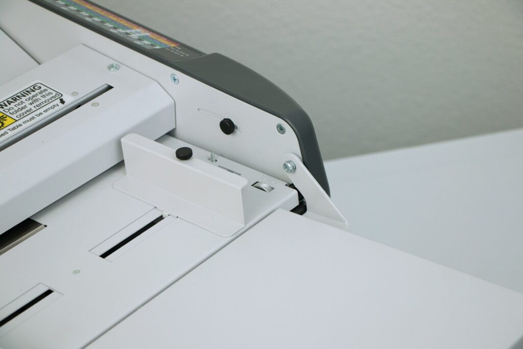 paper folder feeder with skew adjustment on Martin Yale Machine