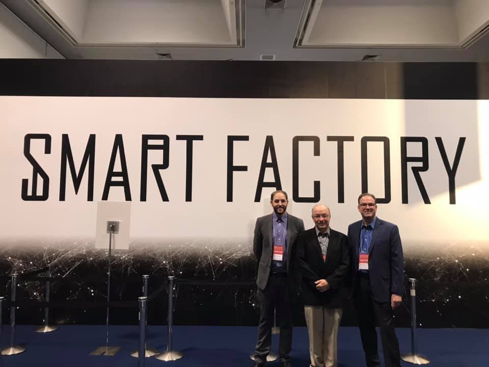 MSL team in front of smart factory sign