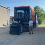 Skids of Planatol Planamelt Pro being unloaded at Mid-State Litho