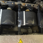 Glue pot on perfect binder being changed out to planatol planamelt pro adhesive